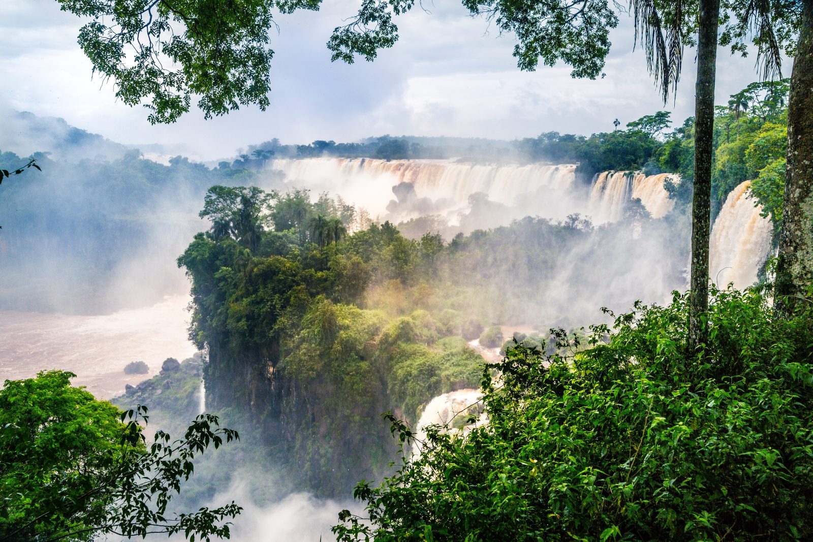 waterfall iguazu national park surrounded by forests covered fog cloudy sky 2