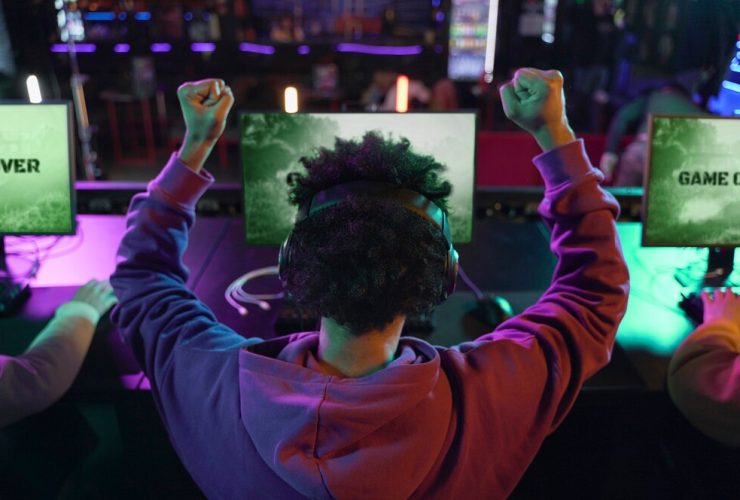 back view man winning videogame 23 2149350002